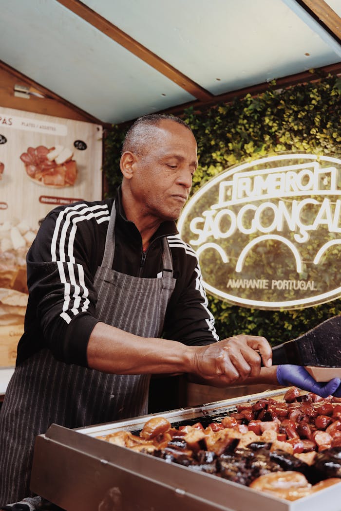 home-hero Street food vendor grilling Portuguese cuisine in Lisbon, Portugal.