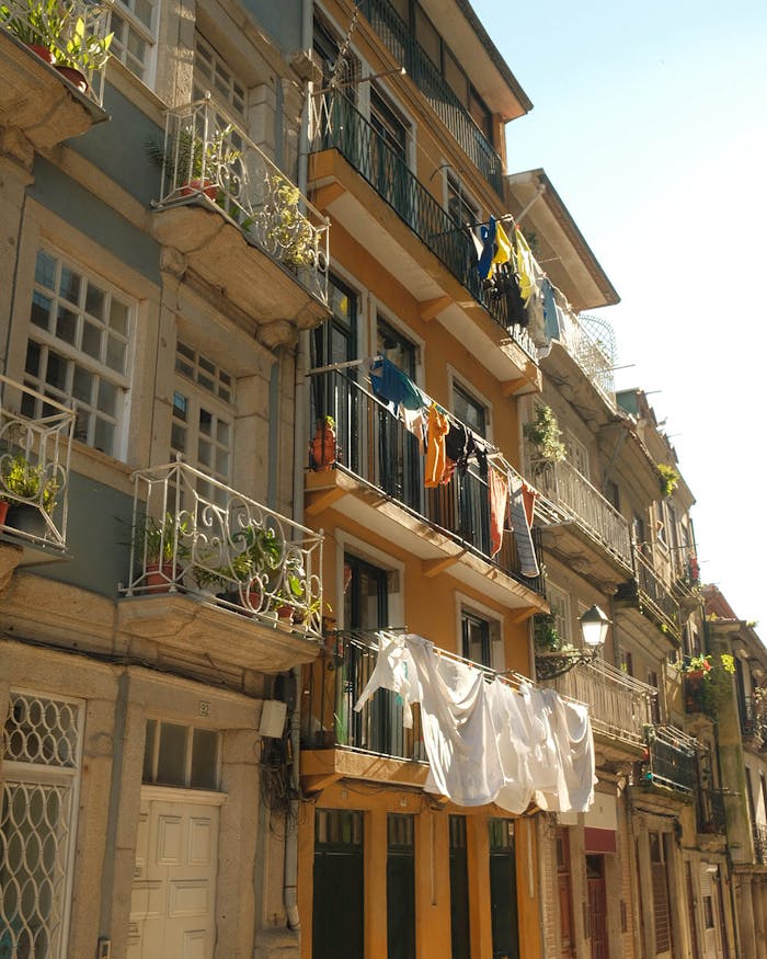 pexels photo 35565366 Cozy street in Porto, Portugal, with clothes drying and sunlit façades.
